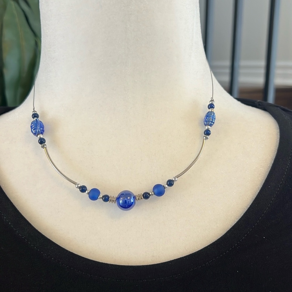 Gorgeous beaded necklace in blues, black, and silver.